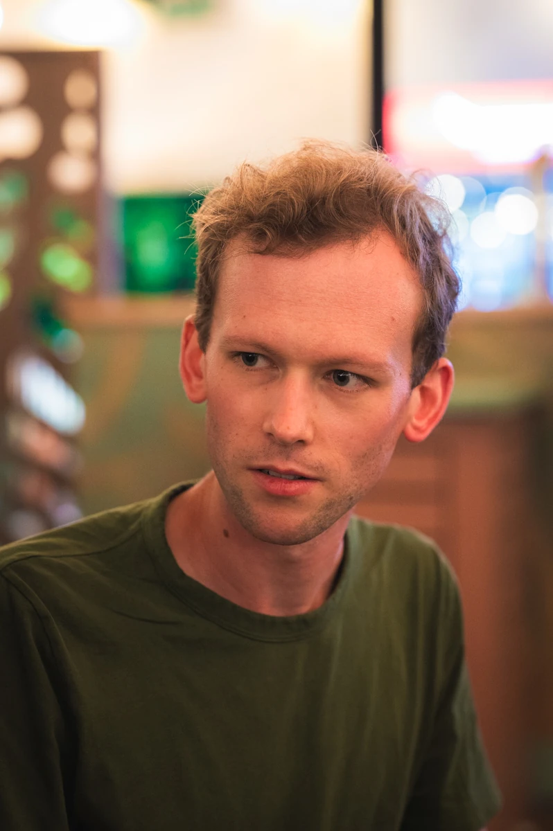 A man with a slightly glazed look in a social setting