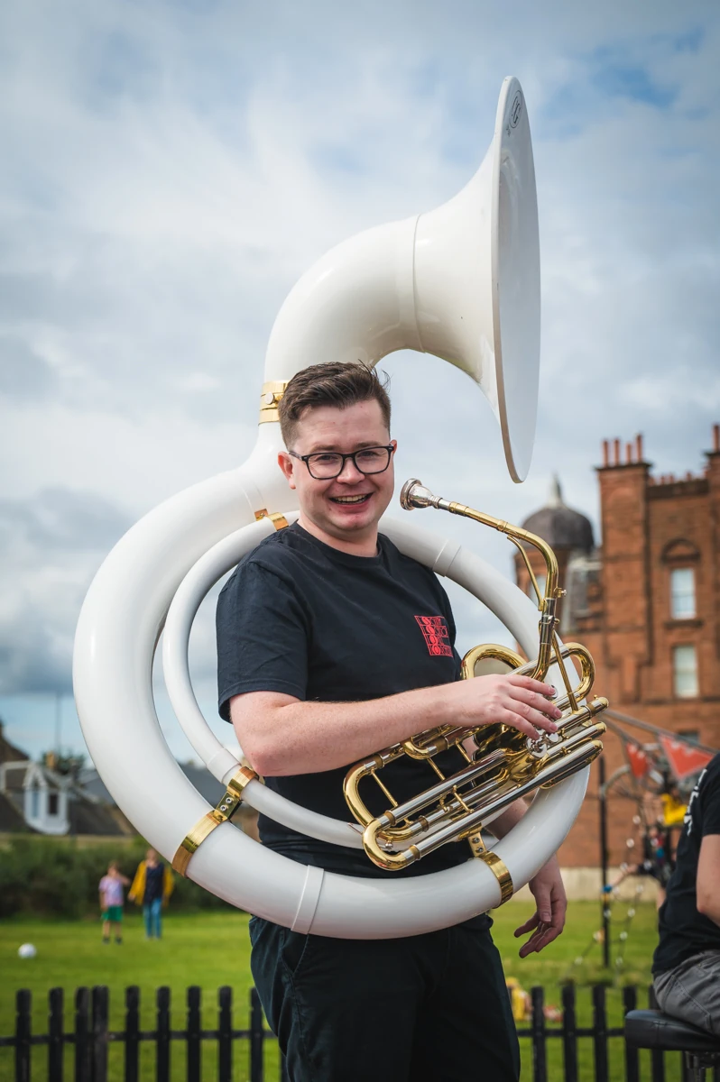 A jazz musician holding a sousaphone