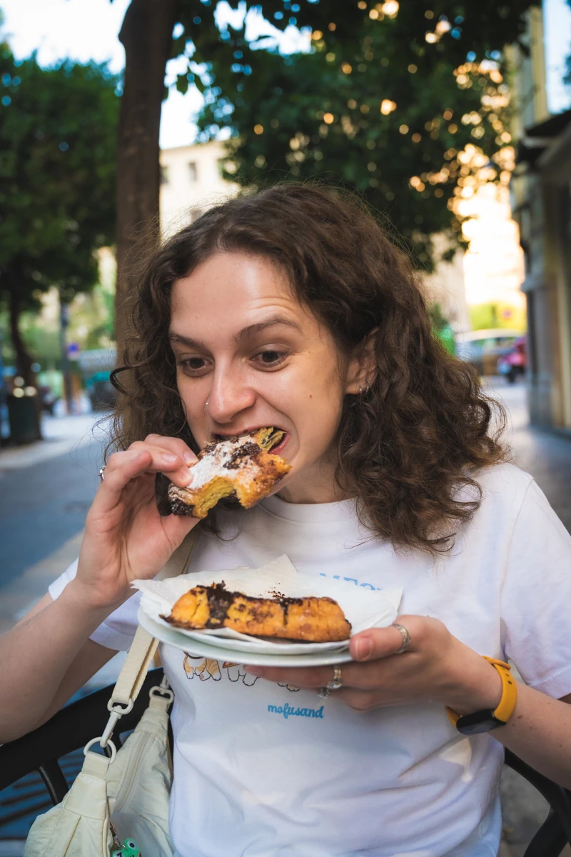 A jazz musician tucking into a pastry