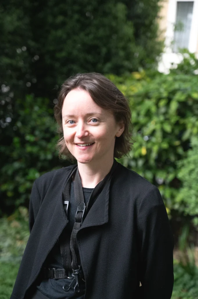 Woman standing in a garden and smiling